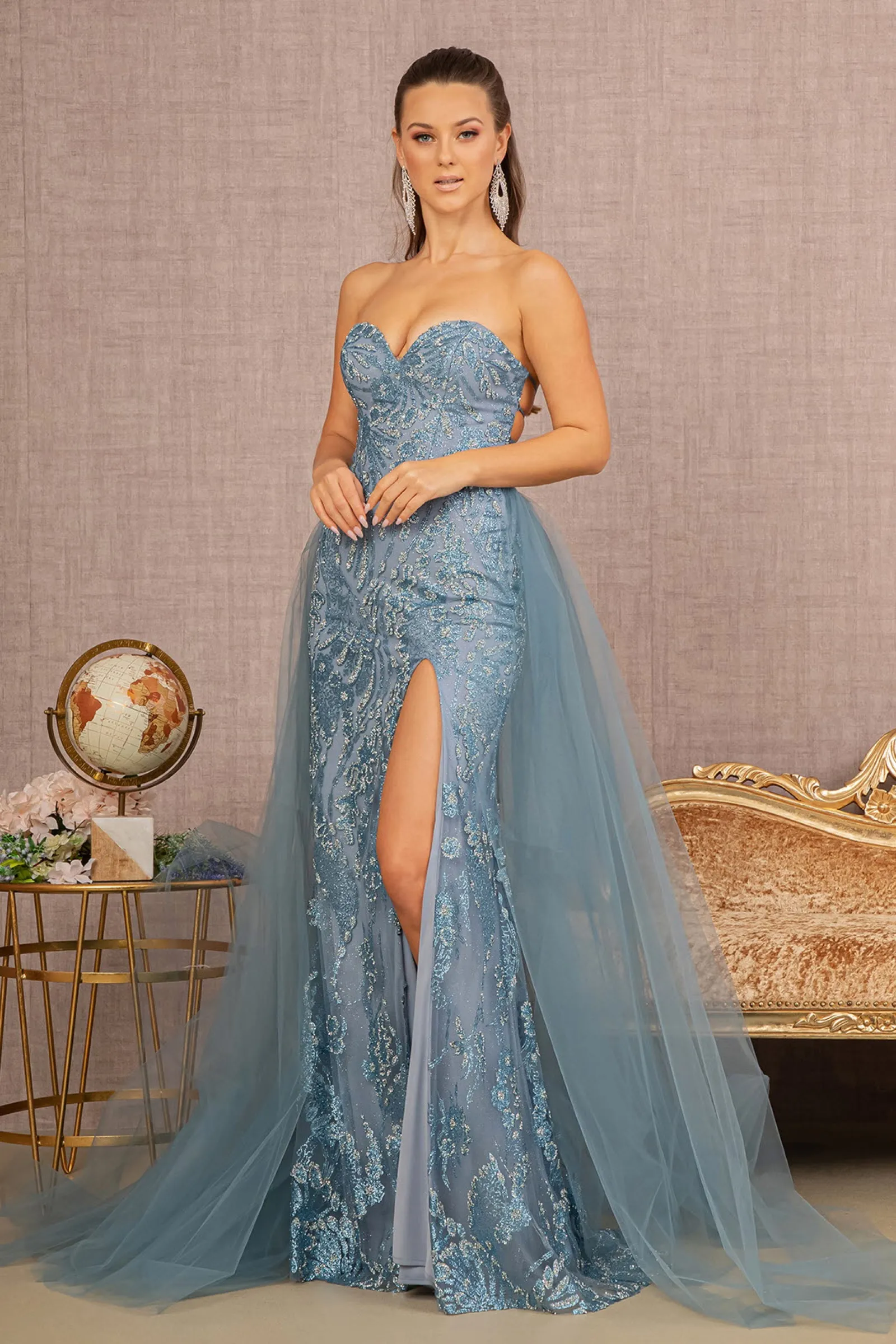 Blue sequin prom gown with a slit